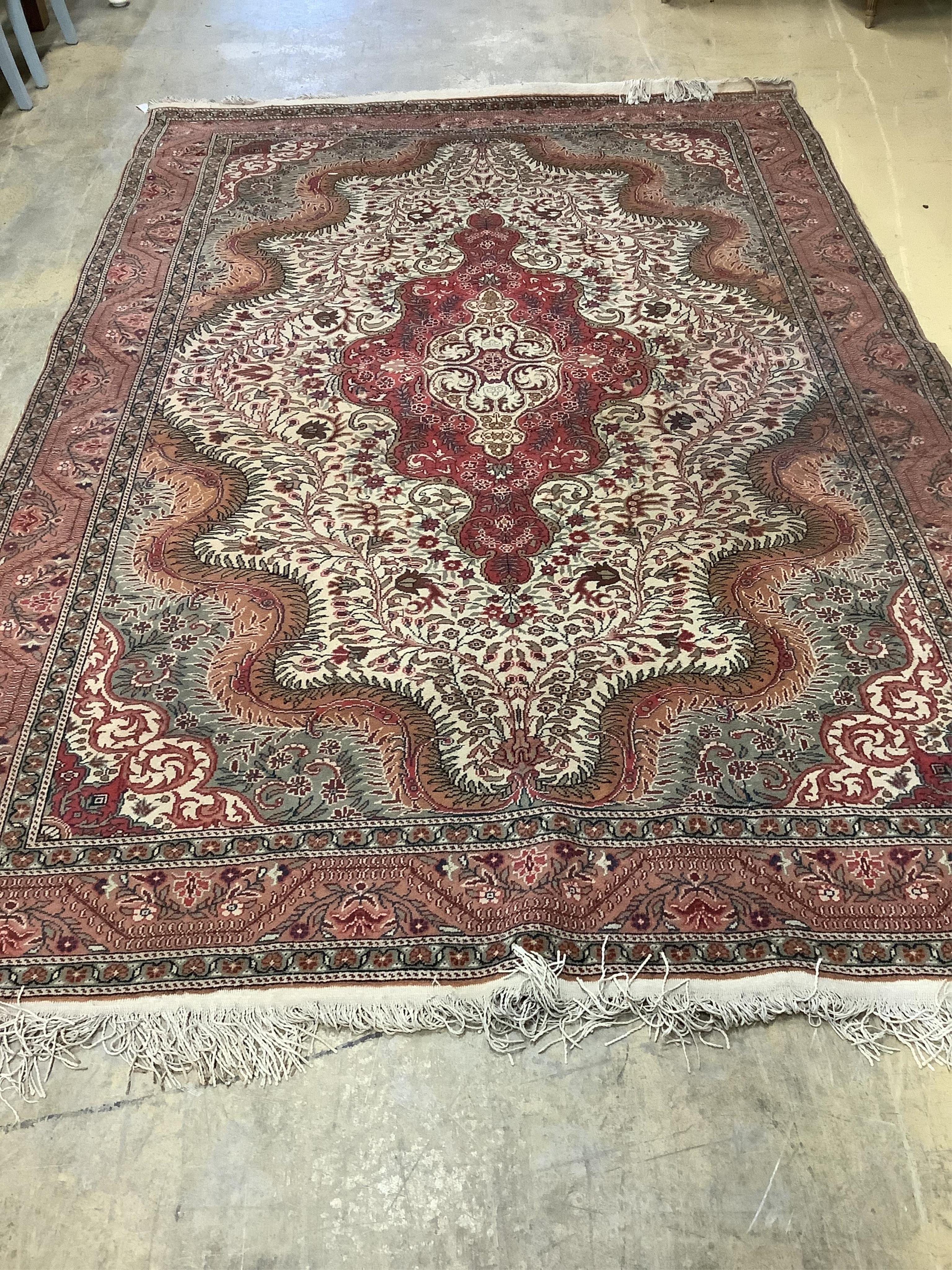A Persian style beige ground carpet, 290 x 197cm. Condition - fair to good